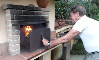 burning branches in the pizza oven